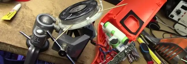 Vacuum cleaner repair parts and tools on a workbench in Lakeland, FL